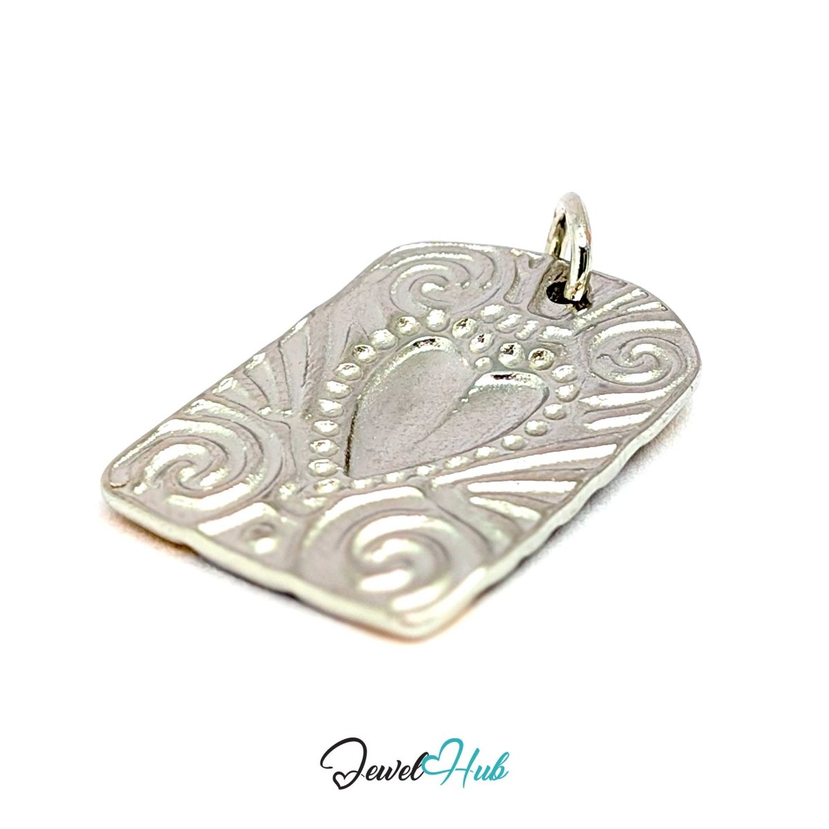 Scroll Plaque charm turned over at an angle, the embossed pattern showing through in silver - JewelHub