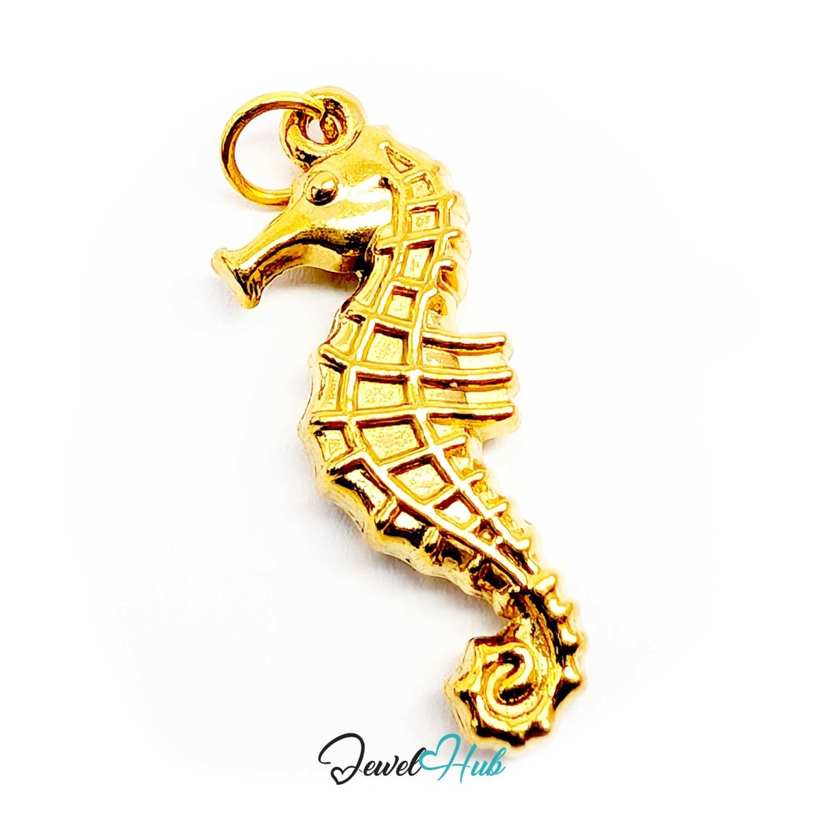 Gold seahorse charm angled to show the arched neck and crowned head - JewelHub