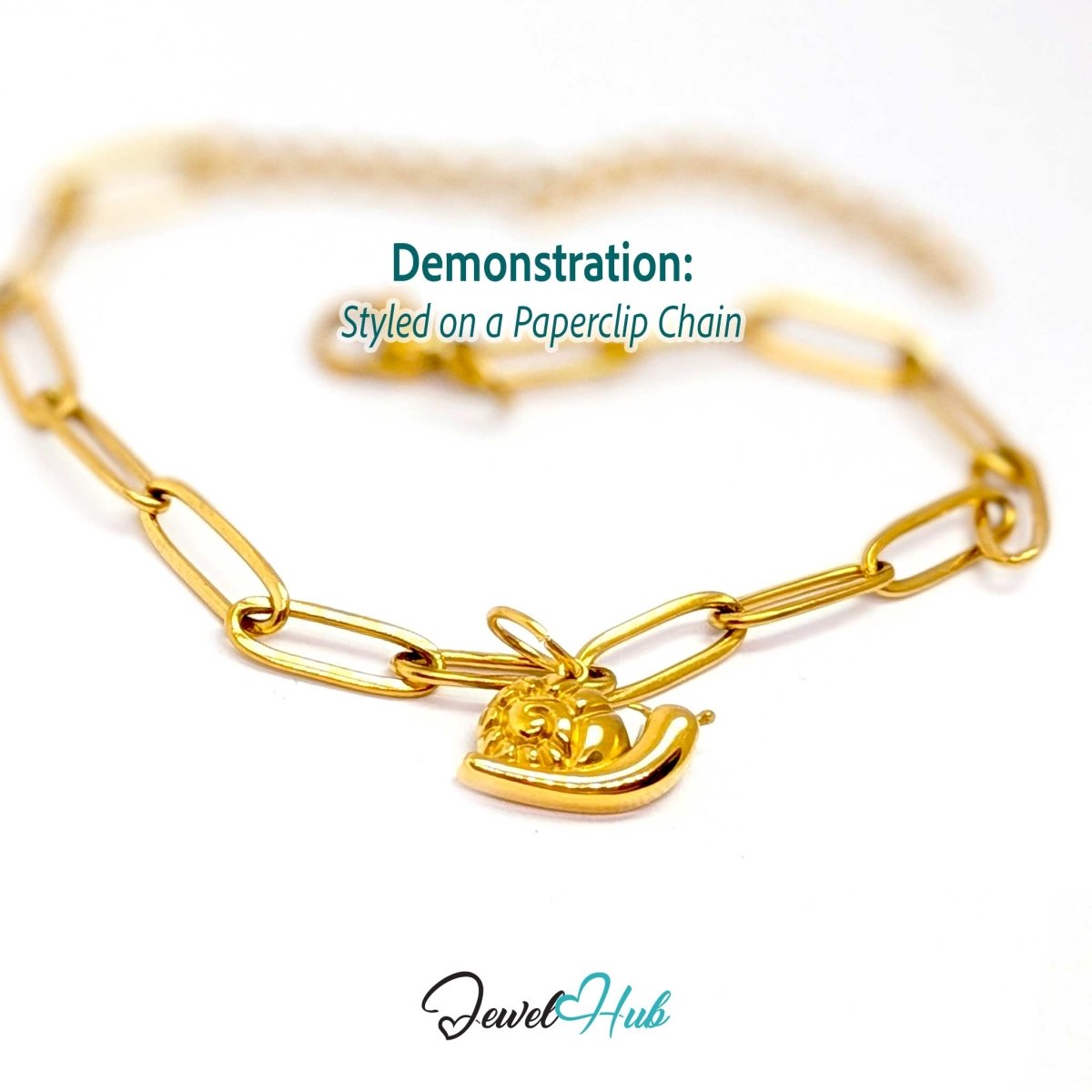 Gold snail charm styled on a gold paperclip chain bracelet - JewelHub