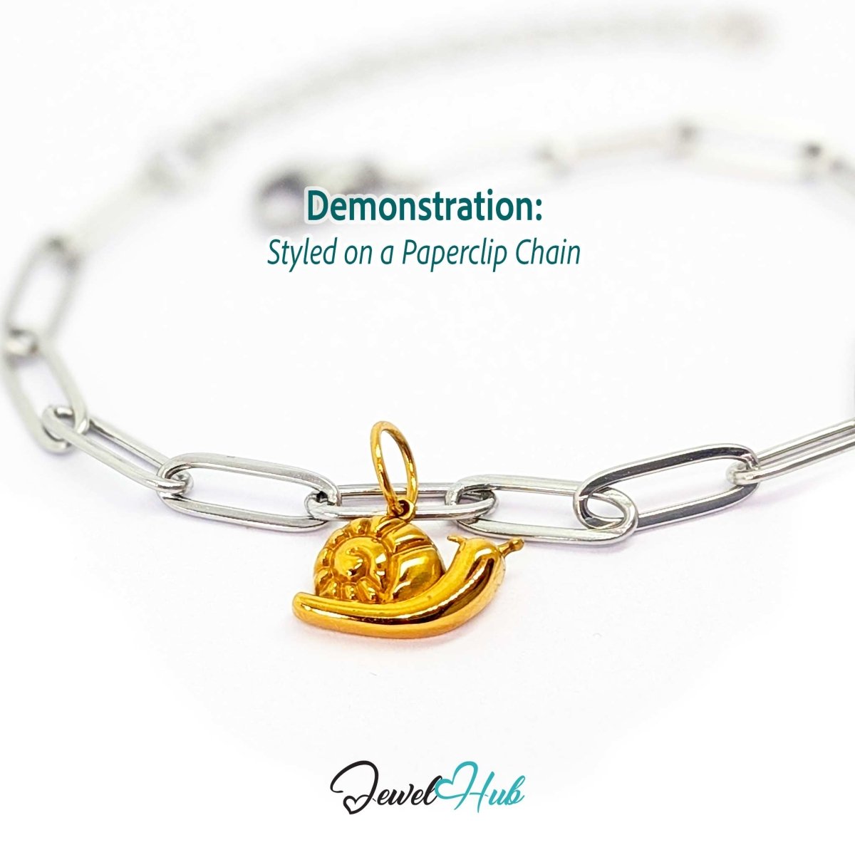 Gold snail charm styled on a silver paperclip chain bracelet for a two-tone look - JewelHub