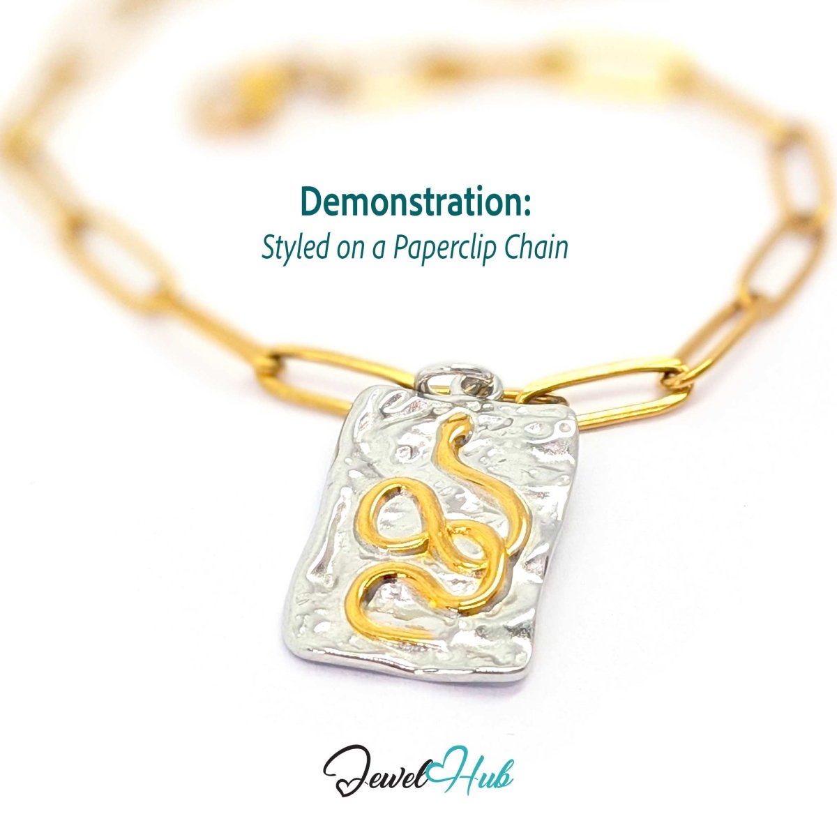 Snake Plate charm, two-tone stainless steel, styled on a gold paperclip chain bracelet - JewelHub