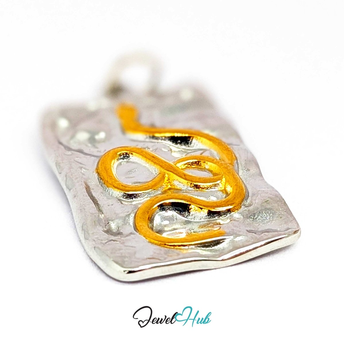 Snake Plate charm at an angle, two-tone stainless steel - the deep hammering and winding gold snake - JewelHub