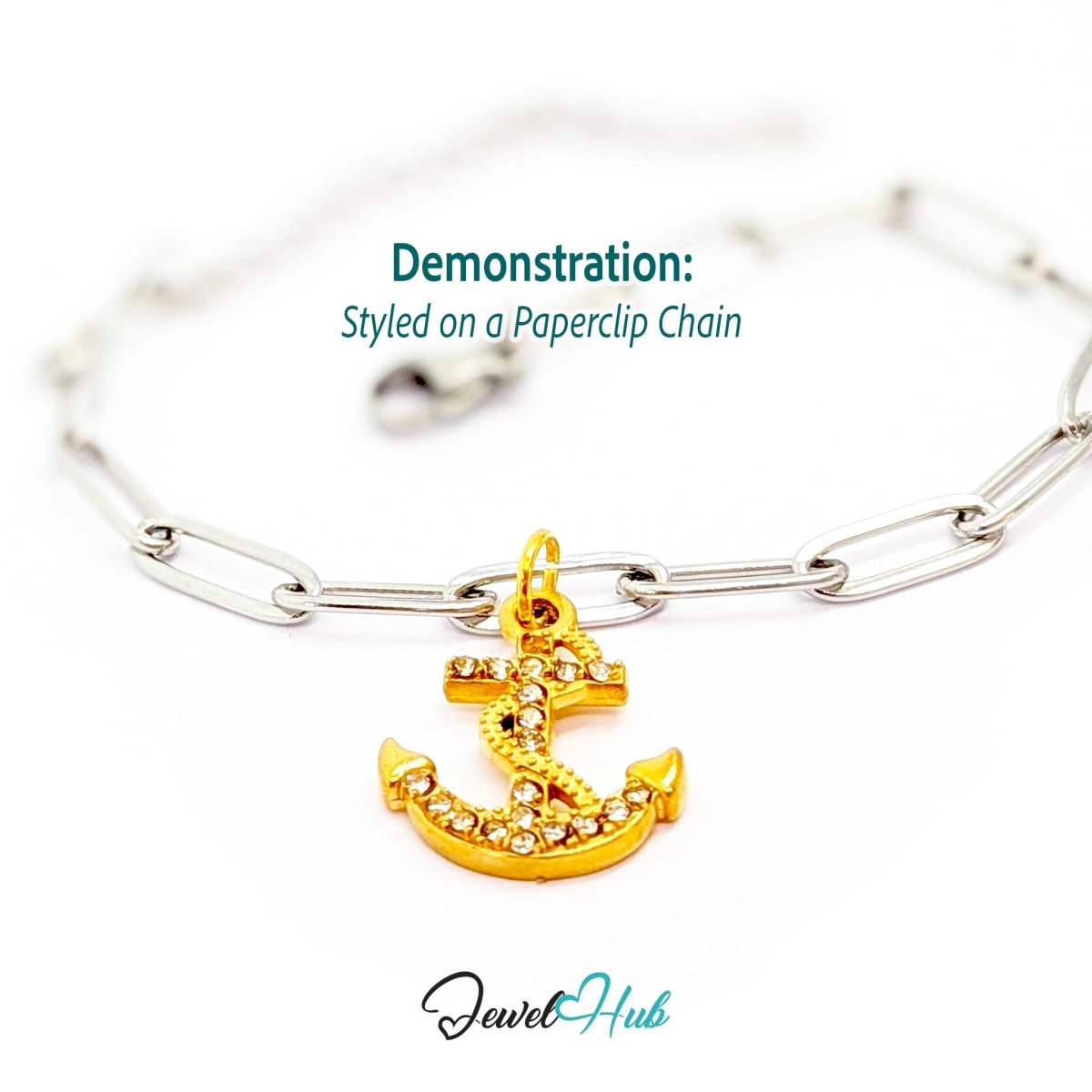 Anchor charm in gold stainless steel with a coiled rope and pave crystals - styled on a silver paperclip chain bracelet - JewelHub