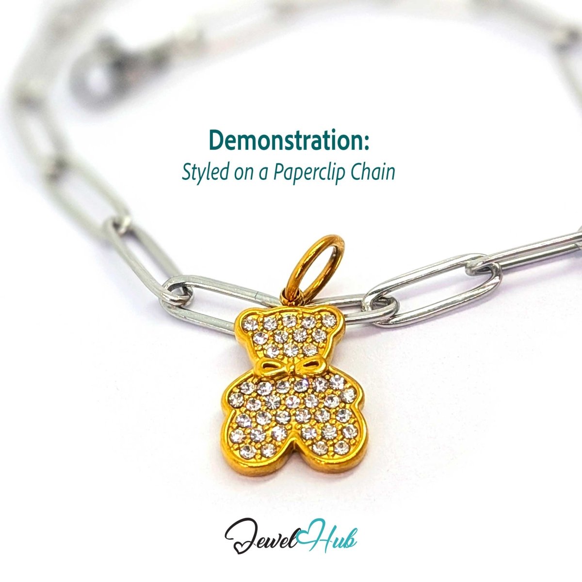 Gold crystal Bow Bear charm styled on a silver paperclip chain bracelet for a two-tone look - JewelHub