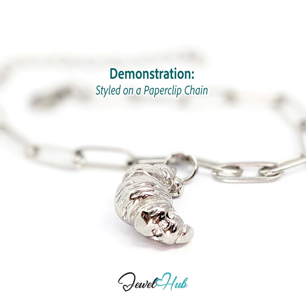 Croissant charm in silver stainless steel with clear crystals - styled on a silver paperclip chain bracelet - JewelHub