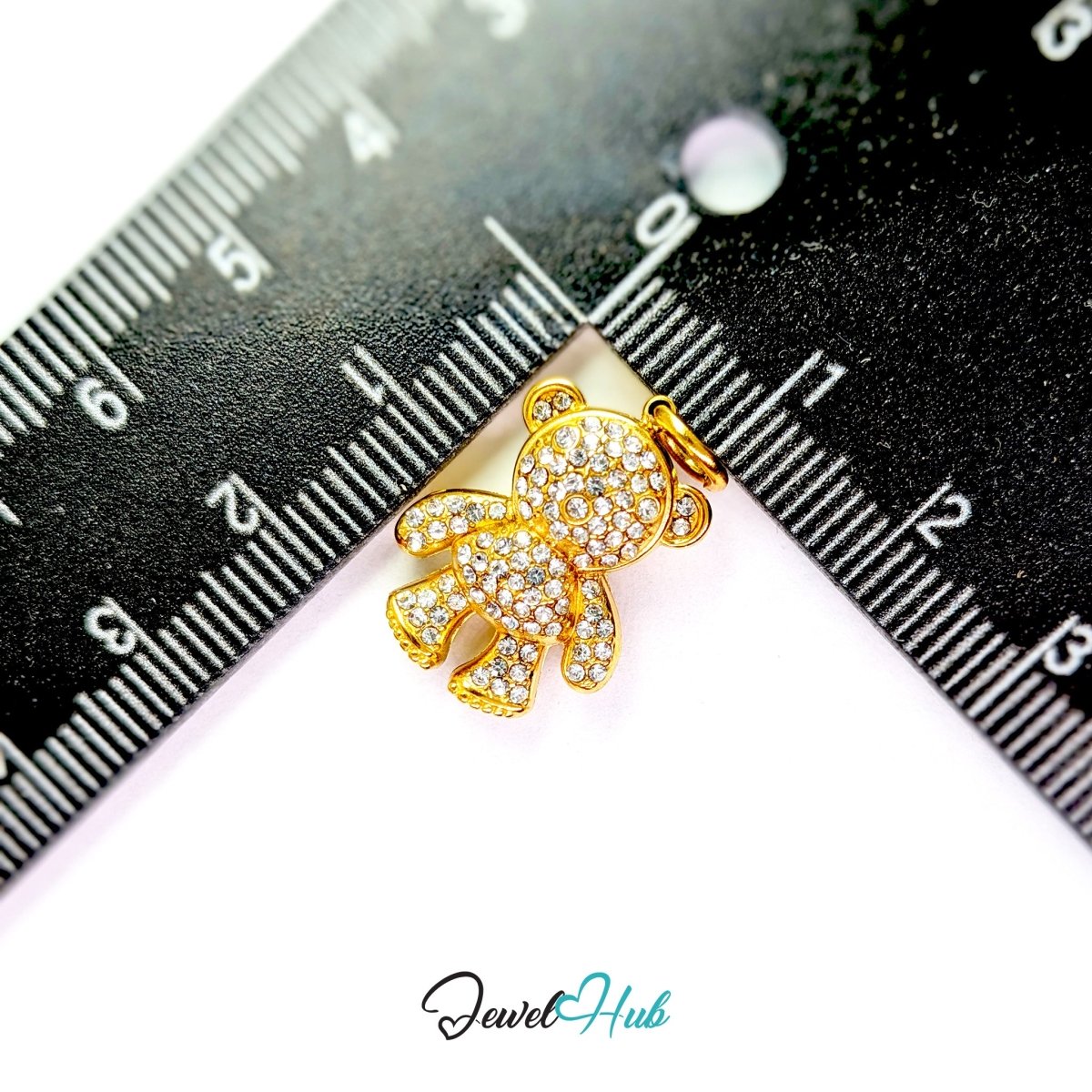 Gold Crystal Cuddle Bear charm measured against a ruler at 14mm wide by 20mm tall - JewelHub