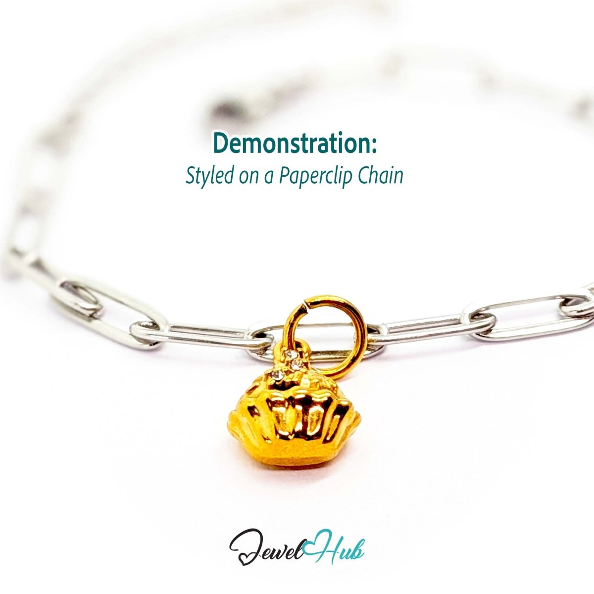 Cupcake charm in gold stainless steel with clear crystals - styled on a silver paperclip chain bracelet - JewelHub