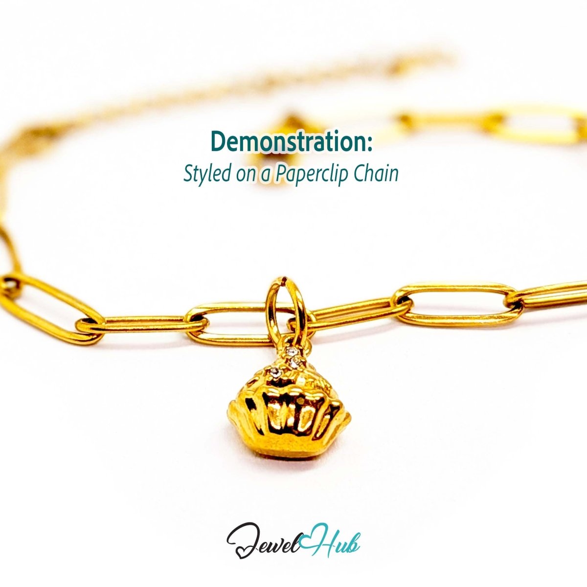 Cupcake charm in gold stainless steel with clear crystals - styled on a gold paperclip chain bracelet - JewelHub