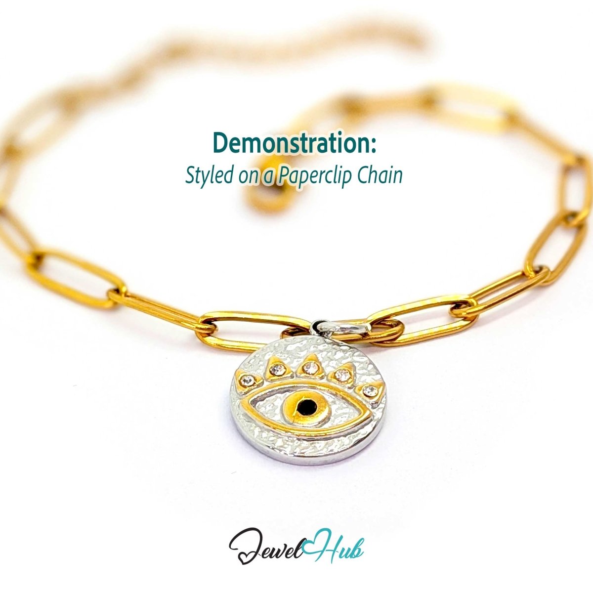 Evil Eye Round charm, two-tone stainless steel, styled on a gold paperclip chain bracelet - JewelHub
