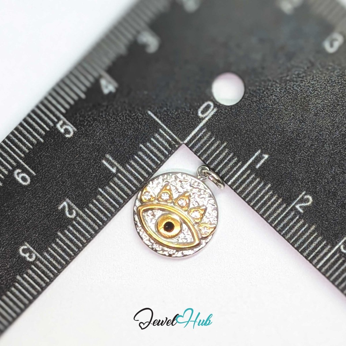 Evil Eye Round charm, two-tone stainless steel, measured against a ruler at 15.2 x 17.6mm - JewelHub