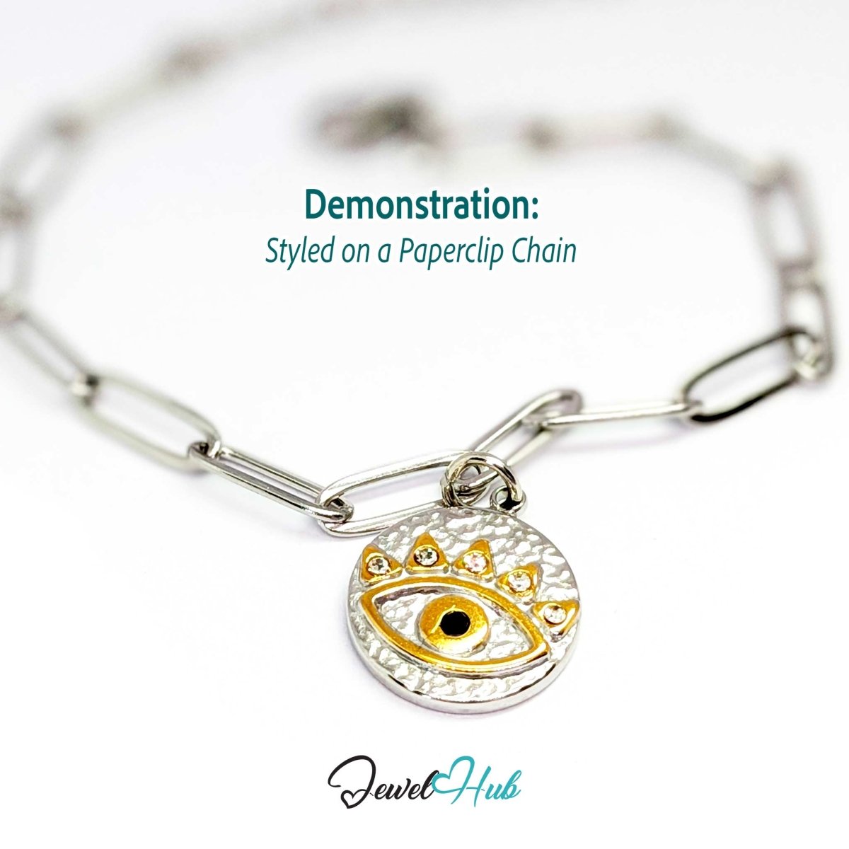 Evil Eye Round charm, two-tone stainless steel, styled on a silver paperclip chain bracelet - JewelHub