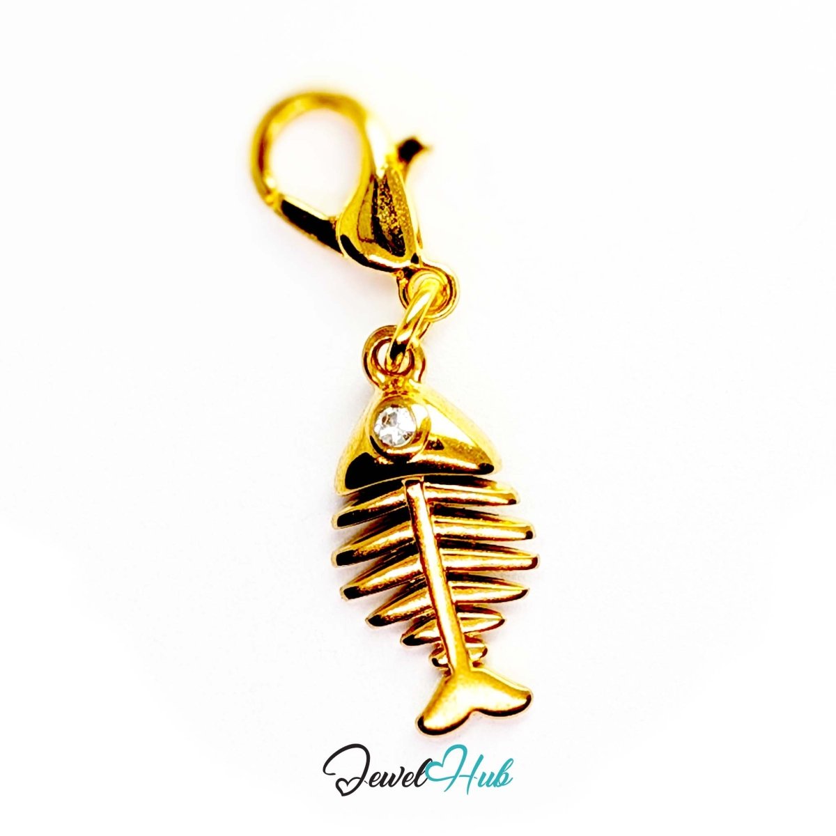 Fish bone charm in gold stainless steel with a crystal eye - shown with the lobster clasp attached - JewelHub