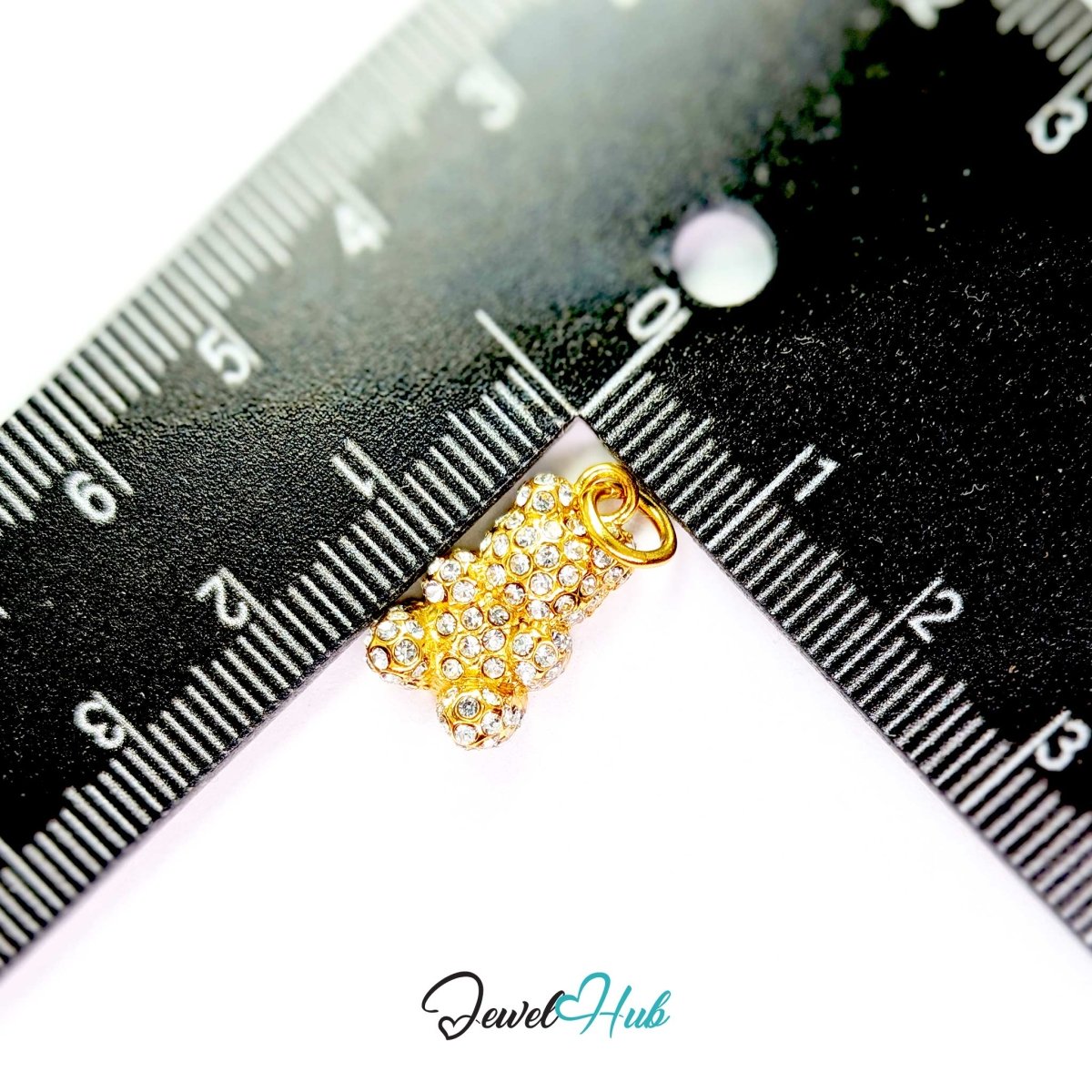 Gold Crystal Gummy Bear charm measured against a ruler at 10mm wide by 18mm tall - JewelHub