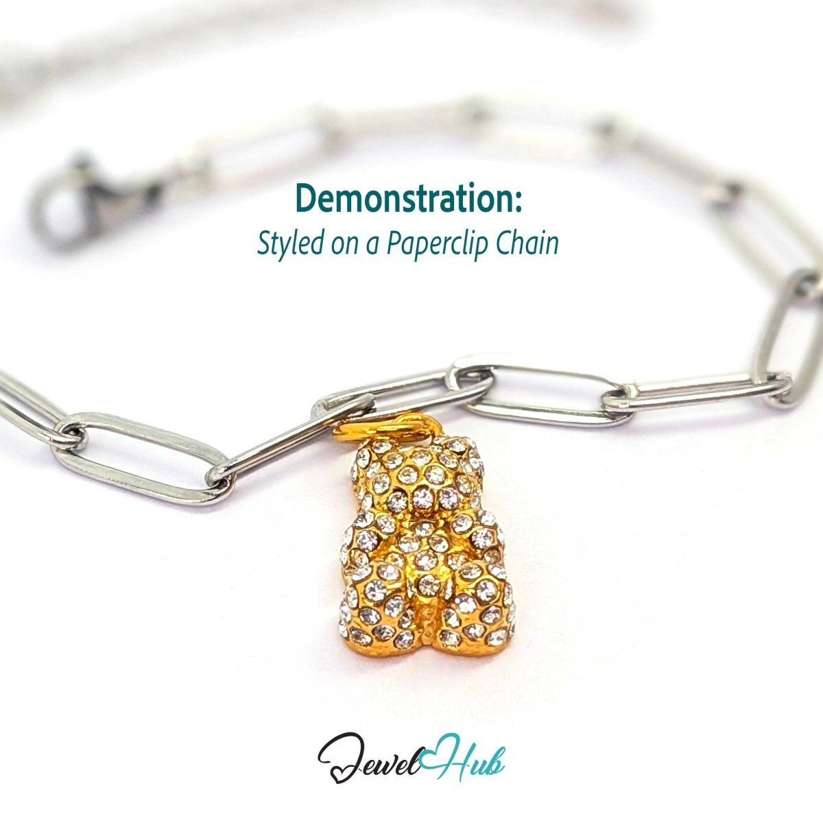 Gold crystal Gummy Bear charm styled on a silver paperclip chain bracelet for a two-tone look - JewelHub