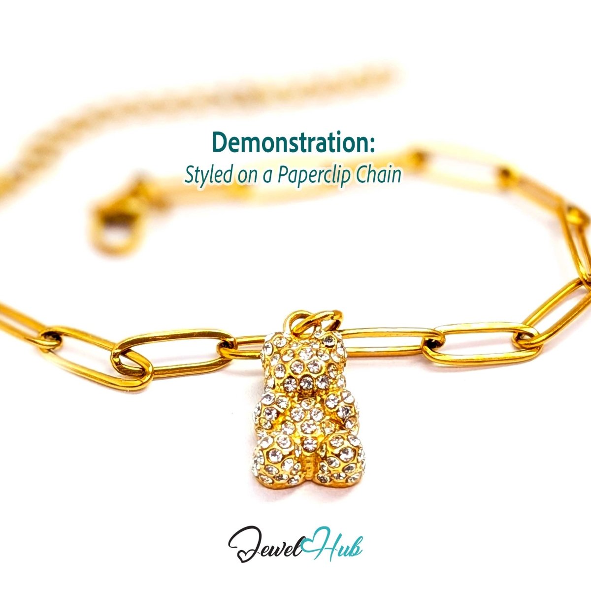 Gold crystal Gummy Bear charm styled on a gold paperclip chain bracelet - JewelHub