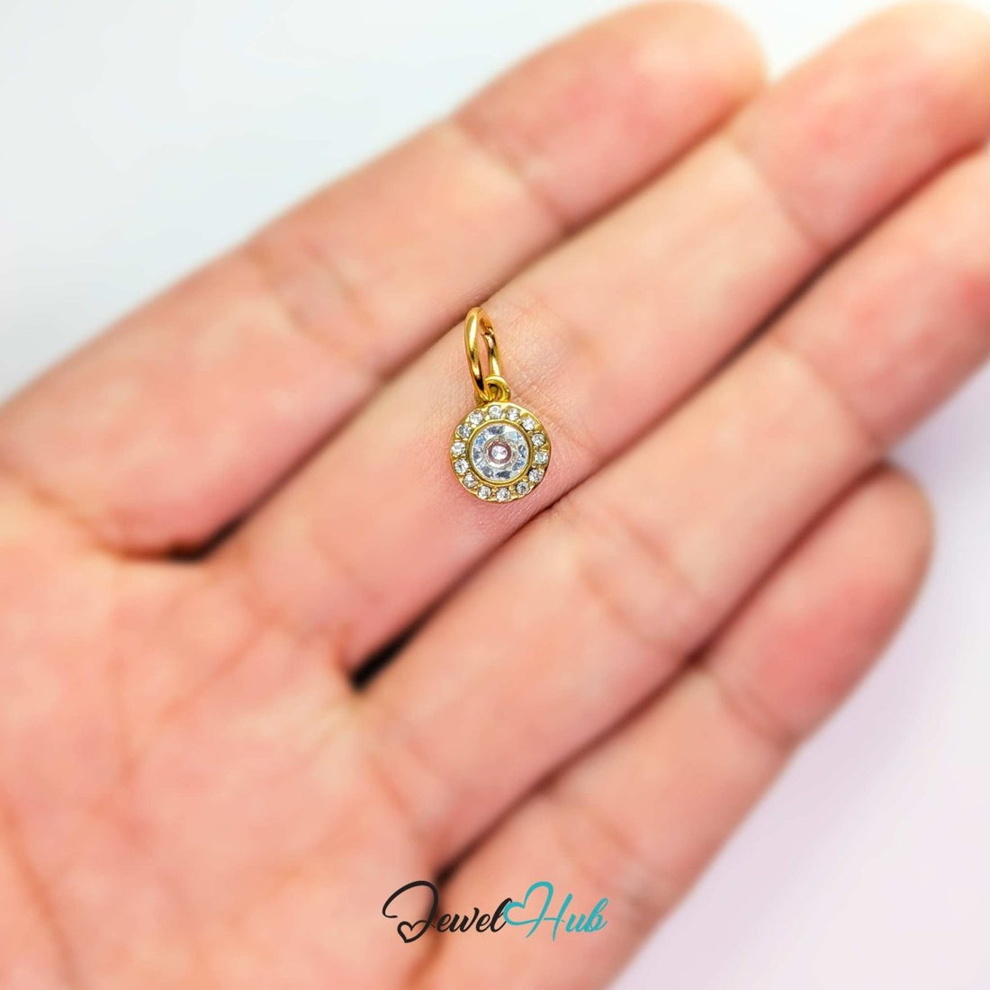 Halo Round charm, gold stainless steel - one crystal ringed by sixteen in a gold halo - JewelHub