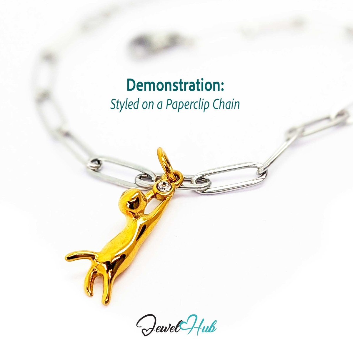 Gold gold cat charm styled on a silver paperclip chain bracelet for a two-tone look - JewelHub