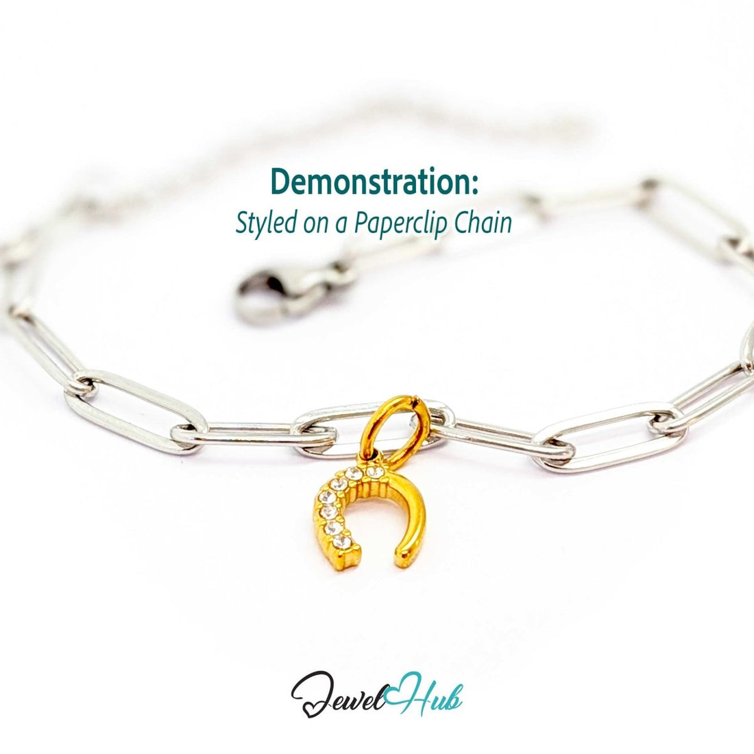 Mini horseshoe charm in gold stainless steel with seven crystals - styled on a silver paperclip chain bracelet - JewelHub