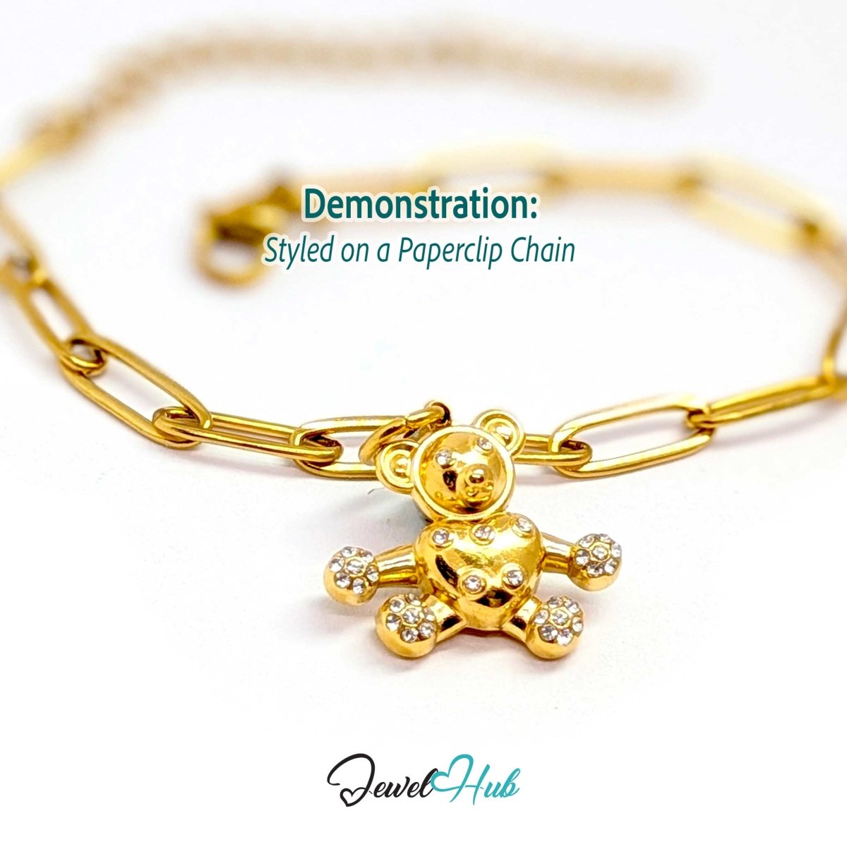 Gold crystal Open Arms Bear charm styled on a gold paperclip chain bracelet - JewelHub