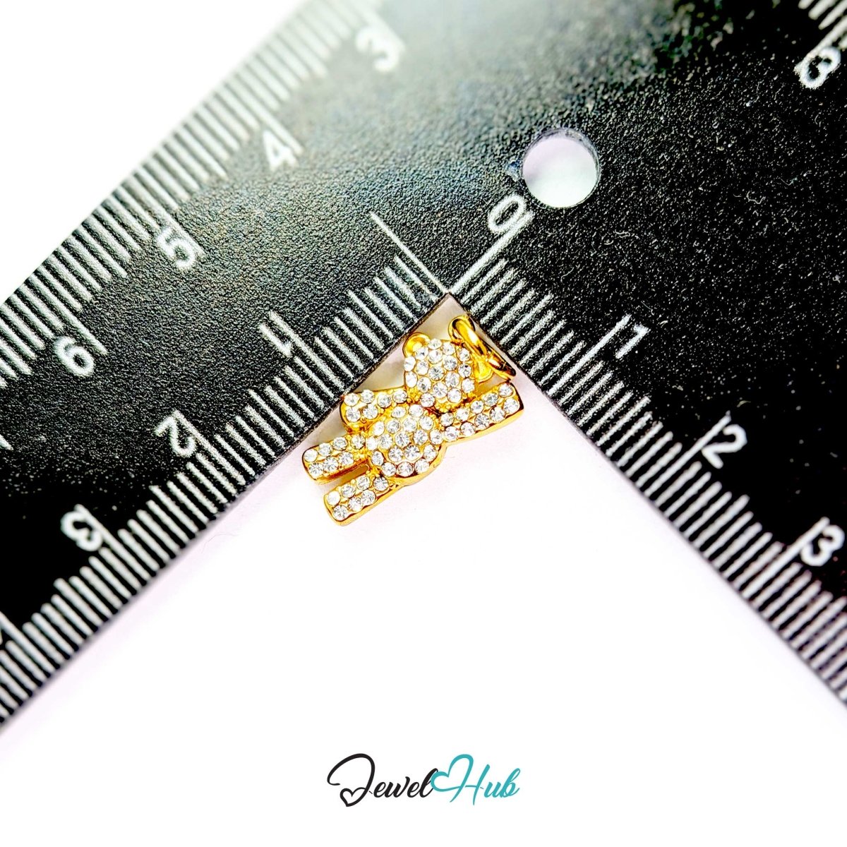 Gold Crystal Petite Bear charm measured against a ruler at 9mm wide by 16mm tall - JewelHub