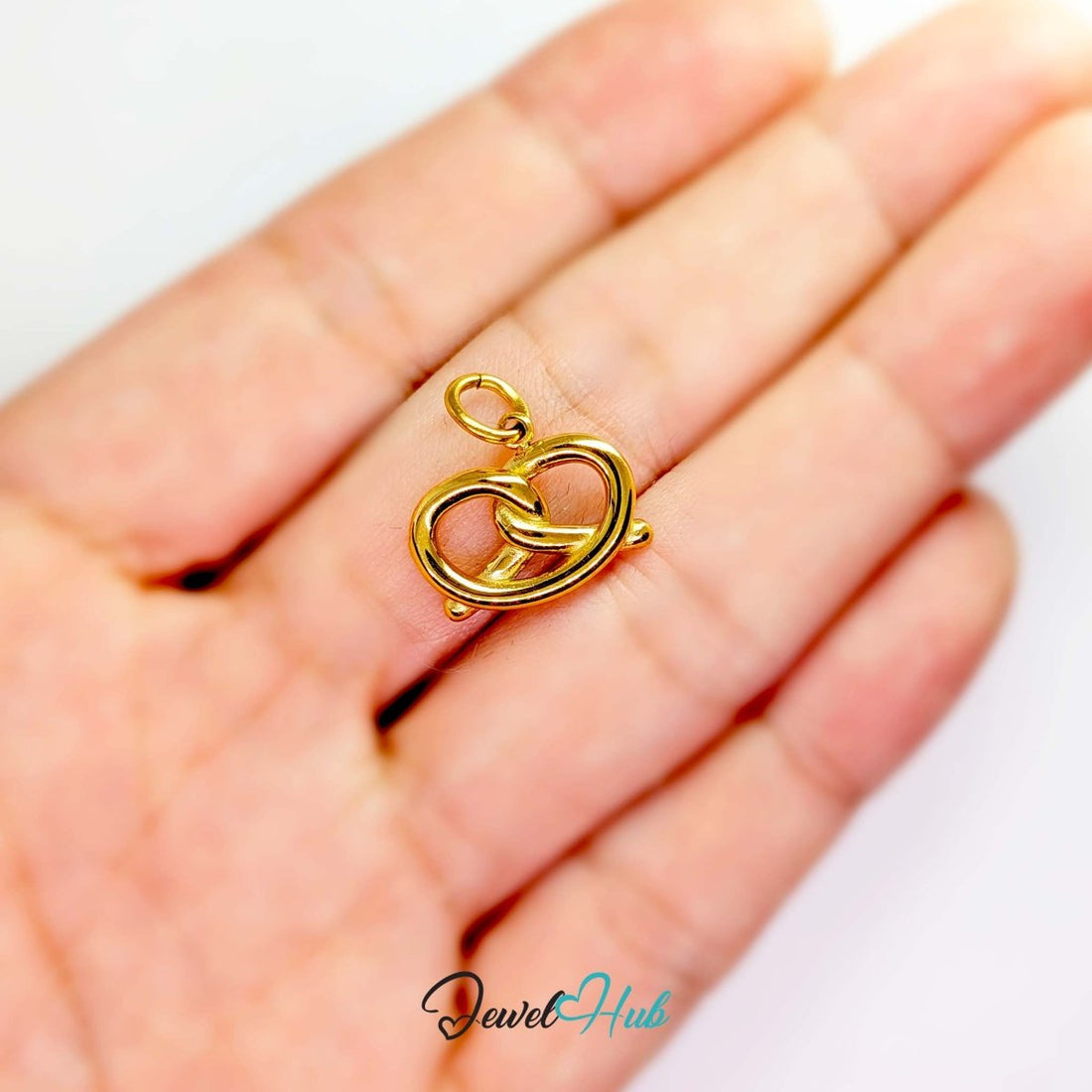 Pretzel charm in gold stainless steel with clear crystals - front view - JewelHub