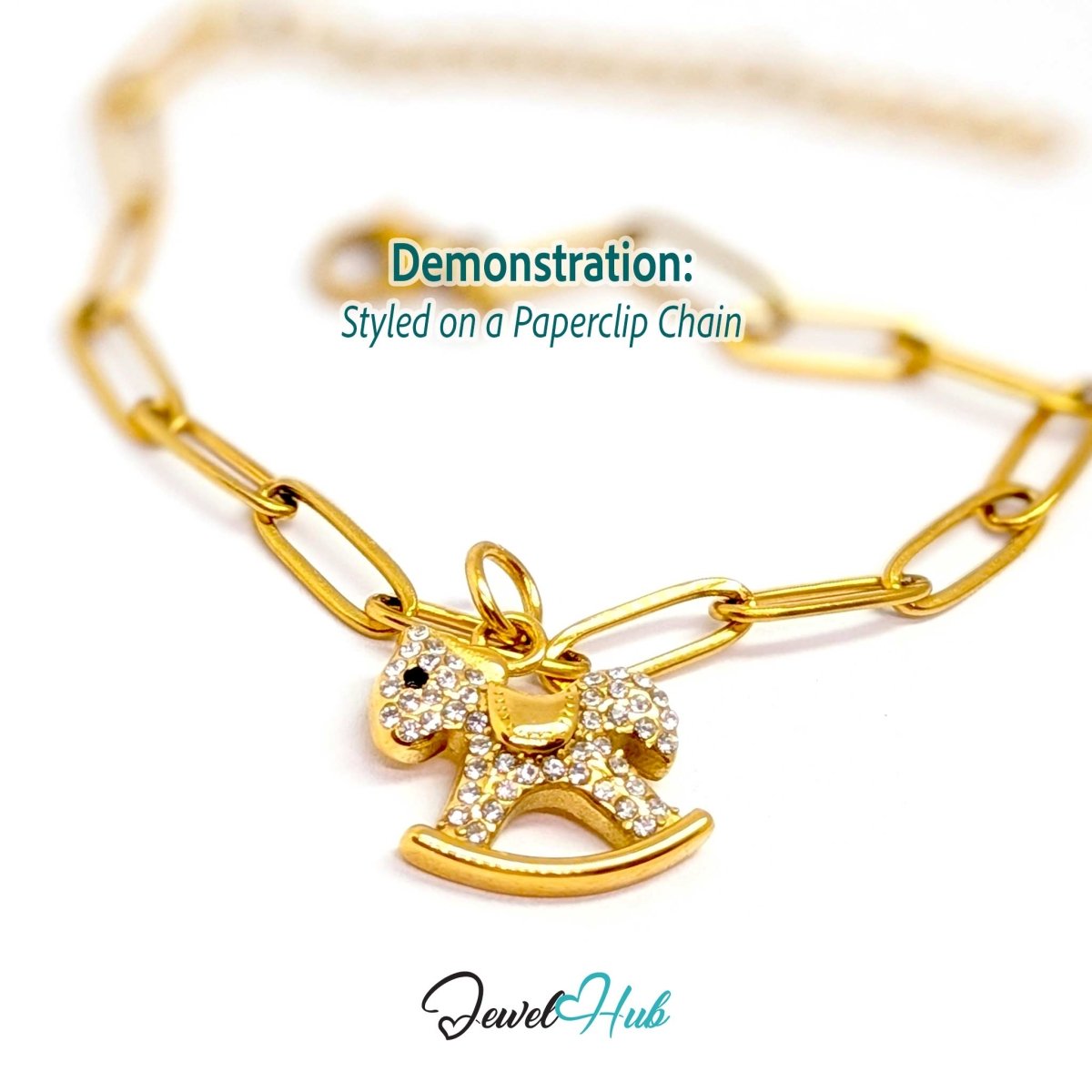 Gold crystal Rocking Horse charm styled on a gold paperclip chain bracelet - JewelHub