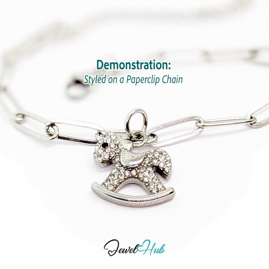 Silver crystal rocking horse charm styled on a silver paperclip chain bracelet - JewelHub