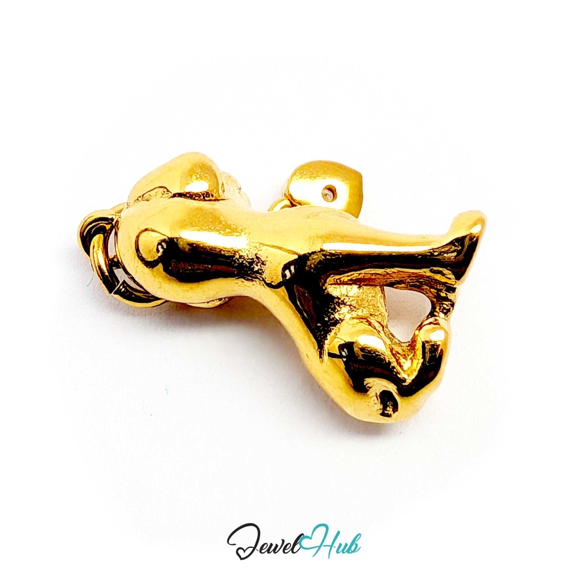 Gold sitting puppy charm laid on its side to show the sculpted paws and tail - JewelHub
