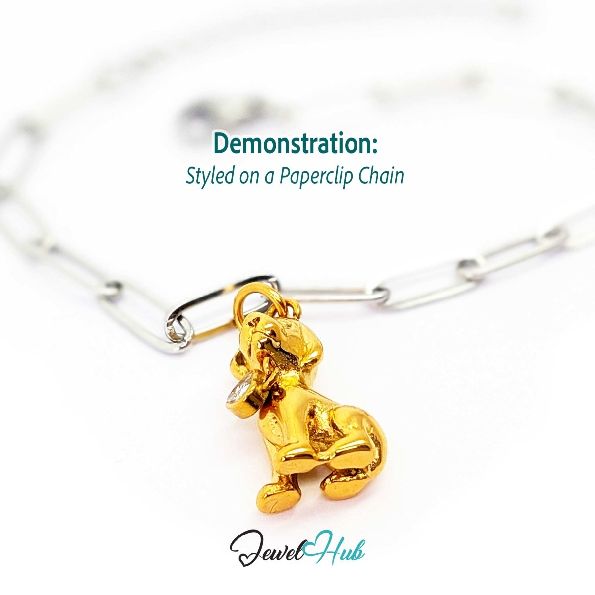 Gold crystal sitting puppy charm styled on a silver paperclip chain bracelet for a two-tone look - JewelHub
