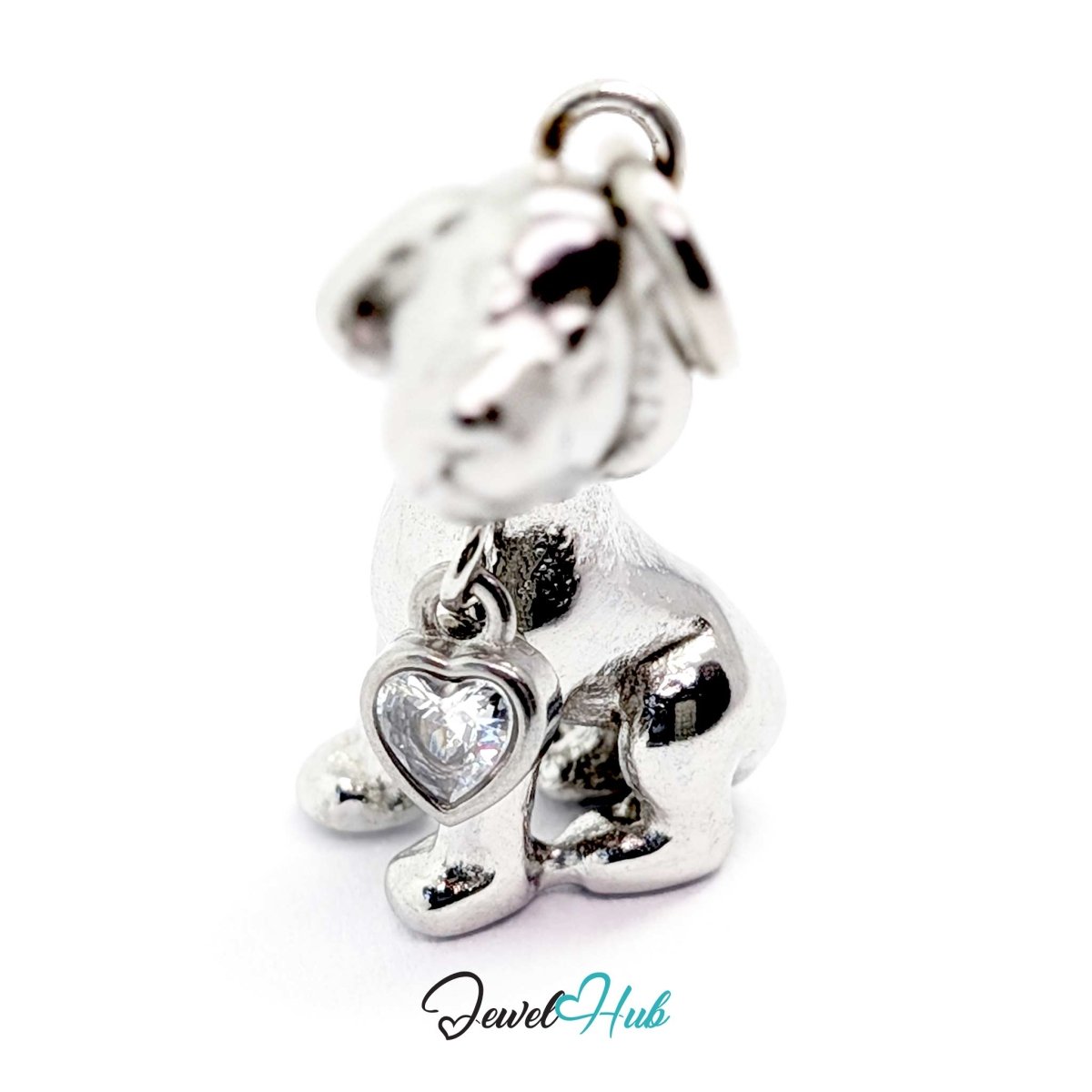 Silver sitting puppy charm from the front, showing the bezel-set heart crystal at its chest - JewelHub