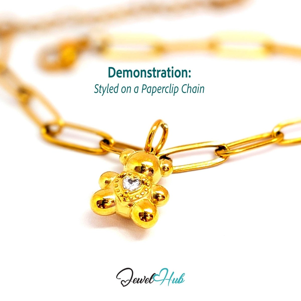 Gold small Crystal Solitaire Heart Bear charm styled on a gold paperclip chain bracelet - JewelHub
