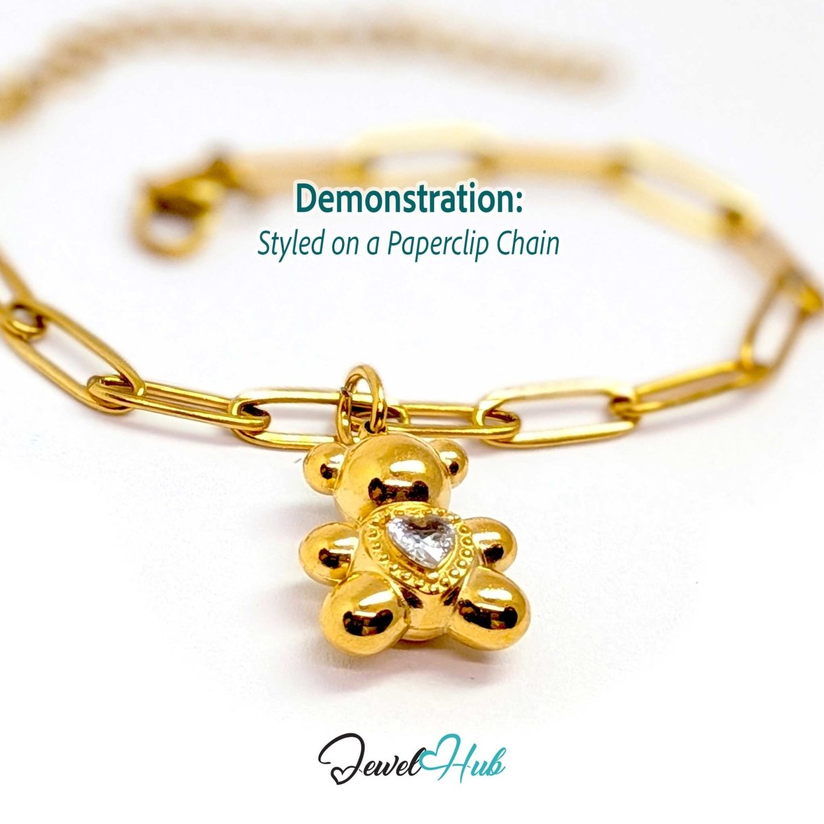Gold crystal Solitaire Heart Bear charm styled on a gold paperclip chain bracelet - JewelHub