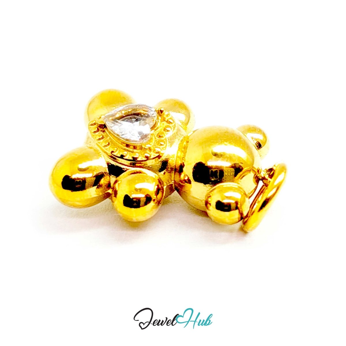 Close view of the bezel-set heart-cut crystal on the gold Solitaire Heart Bear charm - JewelHub