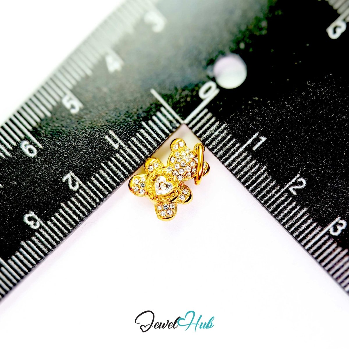 Gold Crystal Sparkle Heart Bear charm measured against a ruler at 11mm wide by 14mm tall - JewelHub