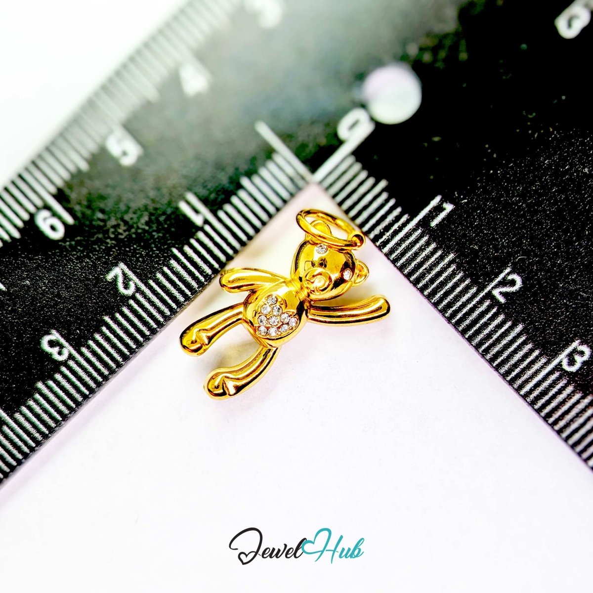 Gold Crystal Tummy Bear charm measured against a ruler at 12mm wide by 22mm tall - JewelHub