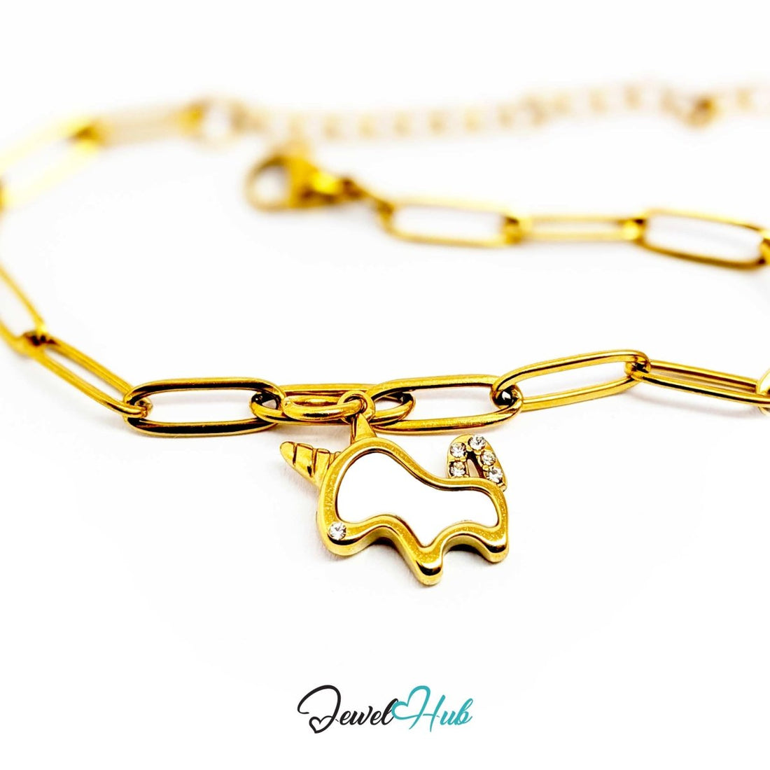 Gold unicorn charm hanging from a gold paperclip chain bracelet - JewelHub