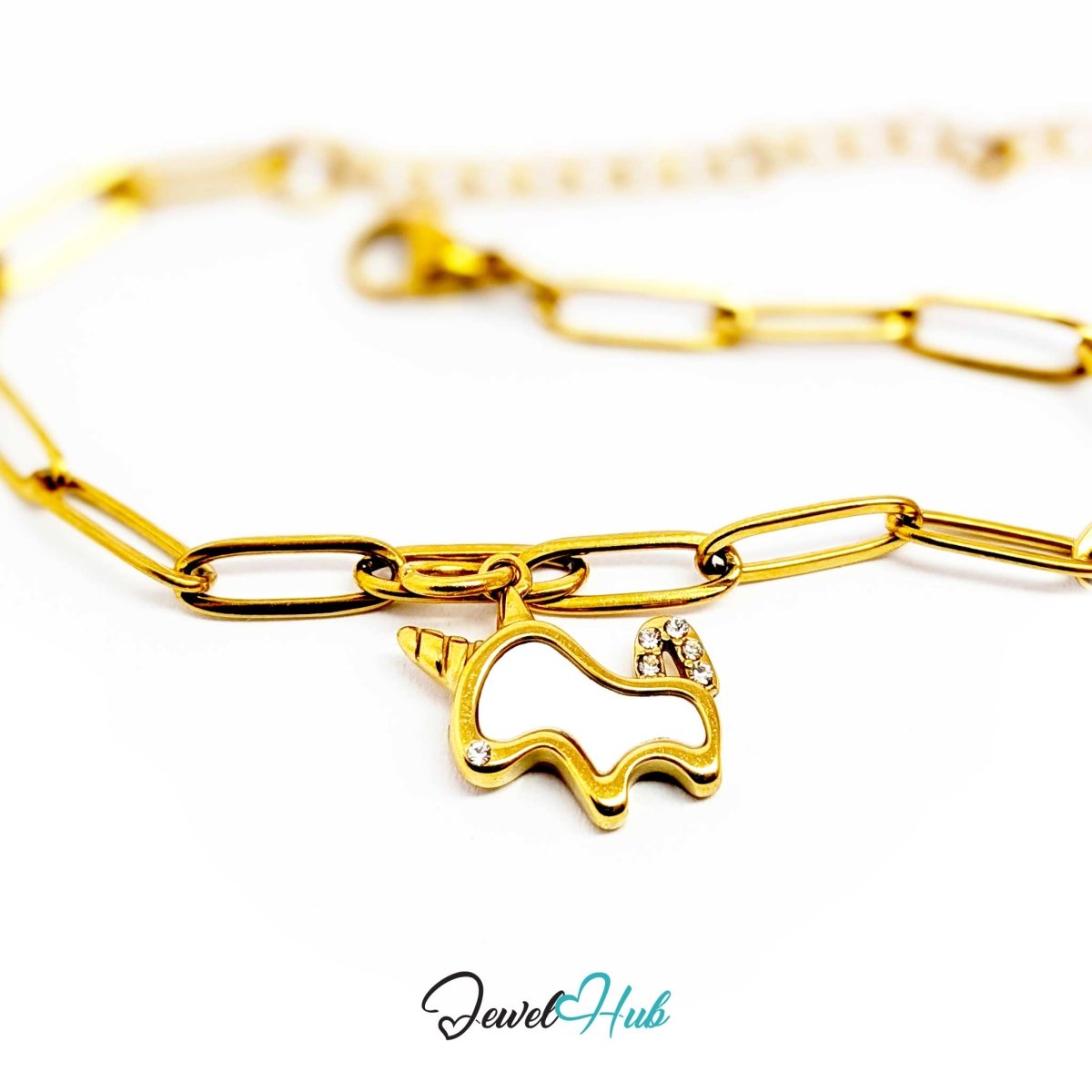 Gold unicorn charm hanging from a gold paperclip chain bracelet - JewelHub