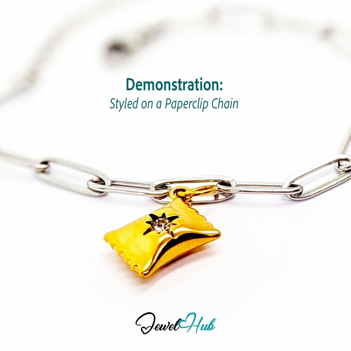 Wrapped sweet charm in gold stainless steel with a clear crystal - styled on a silver paperclip chain bracelet - JewelHub