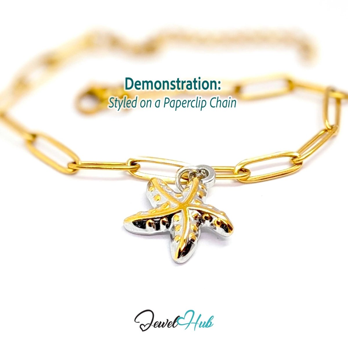 DuoTone starfish charm styled on a gold paperclip chain bracelet - JewelHub