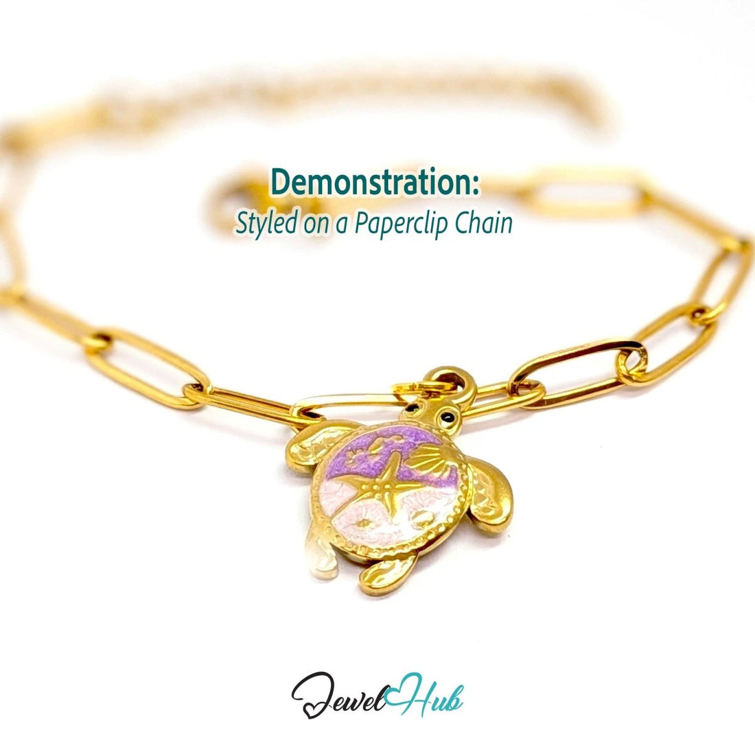 Gold sea turtle charm styled on a gold paperclip chain bracelet - JewelHub