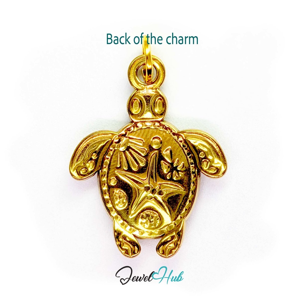 Back of the purple sea turtle charm - patterned gold underside with a raised starfish - JewelHub