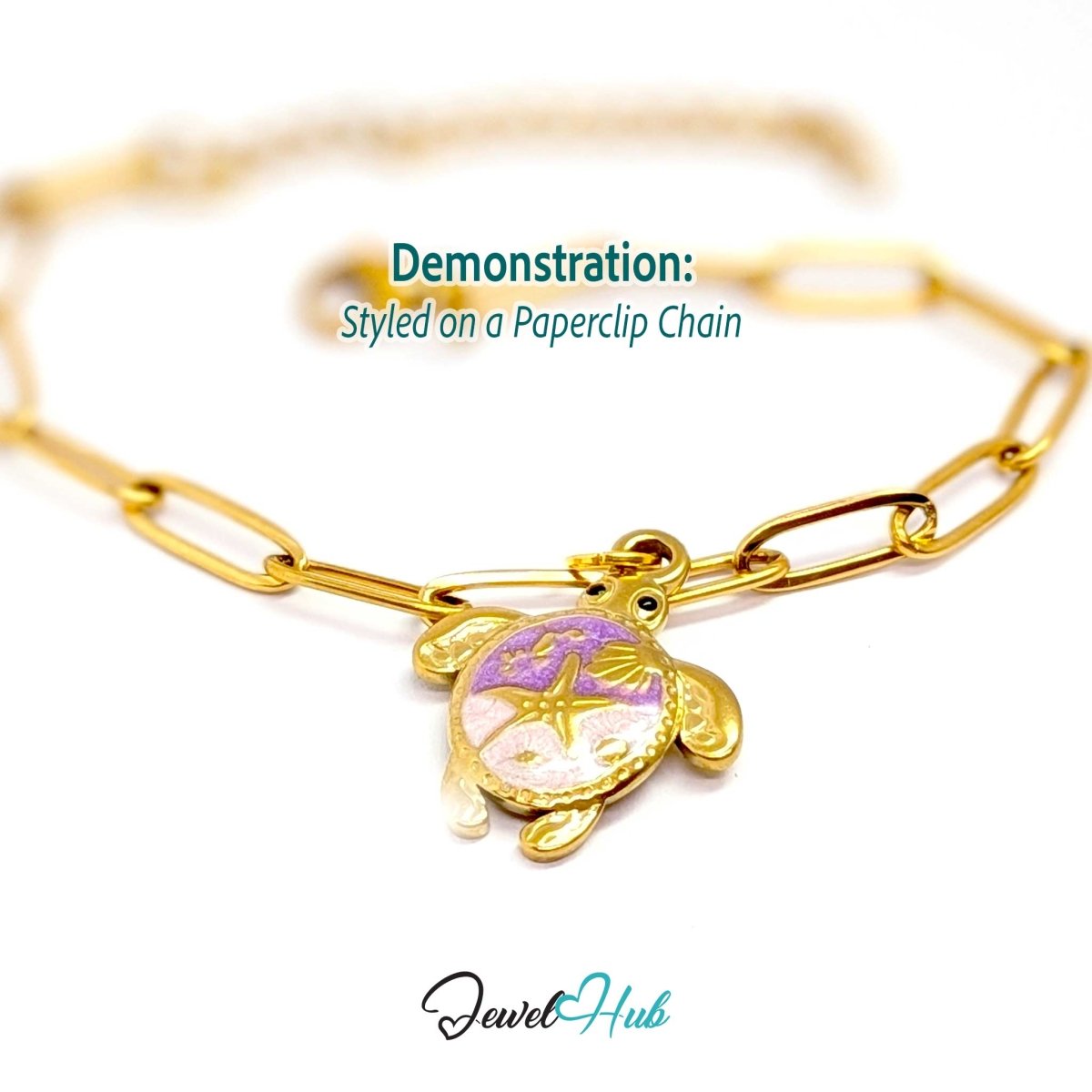 Purple enamel sea turtle charm styled on a gold paperclip chain bracelet - JewelHub