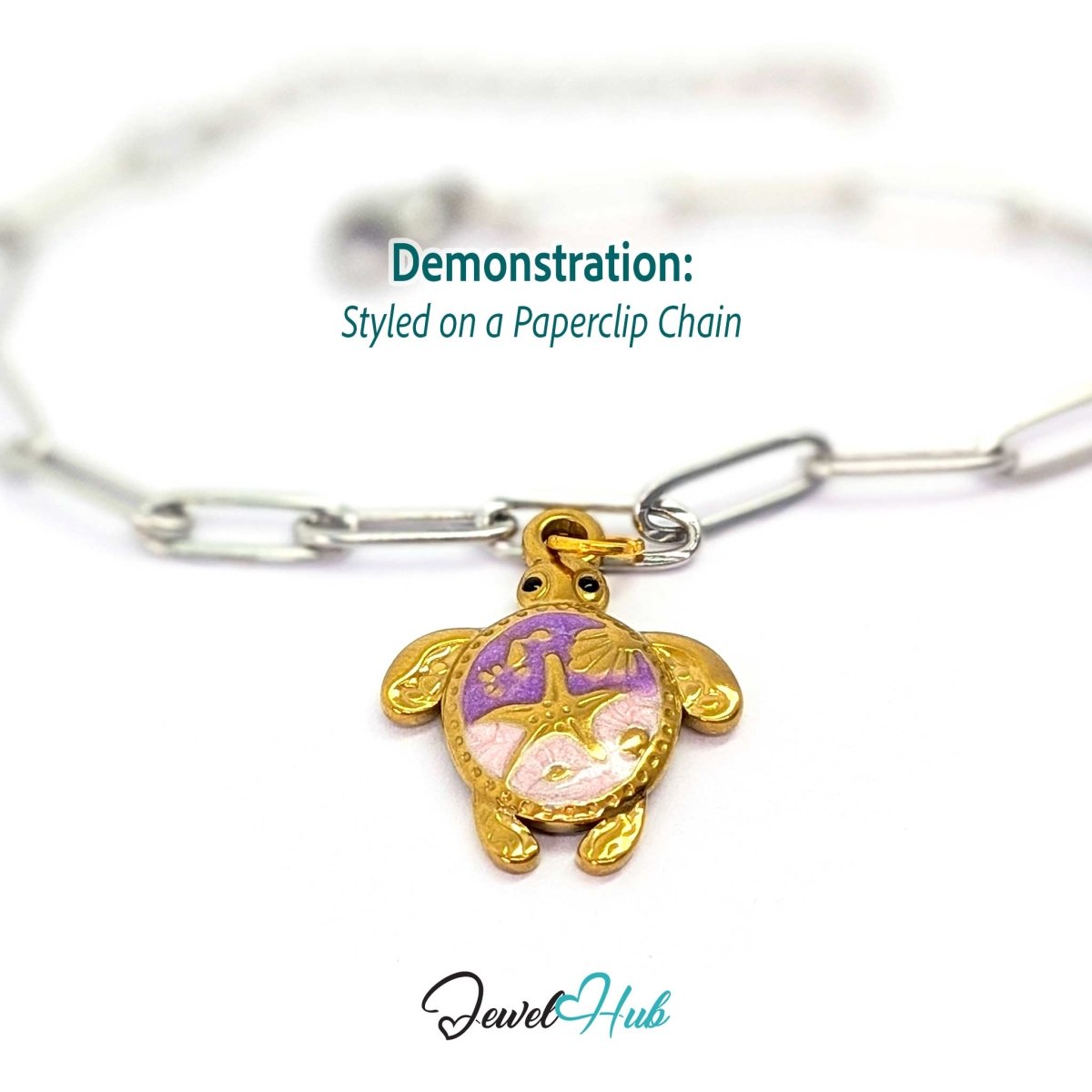 Gold sea turtle charm styled on a silver paperclip chain bracelet for a two-tone look - JewelHub