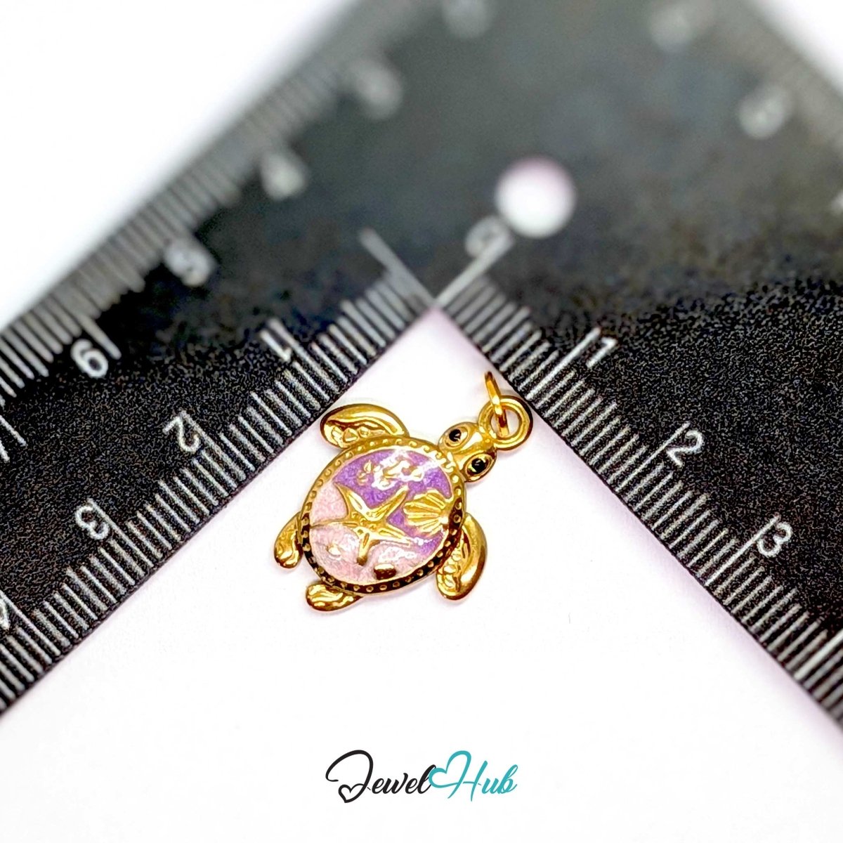 Purple sea turtle charm measured against a ruler at 17.6mm wide by 23.3mm tall - JewelHub