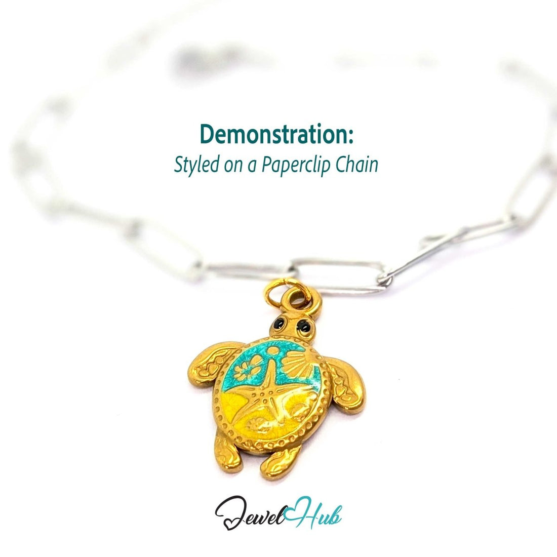 Gold sea turtle charm styled on a silver paperclip chain bracelet for a two-tone look - JewelHub