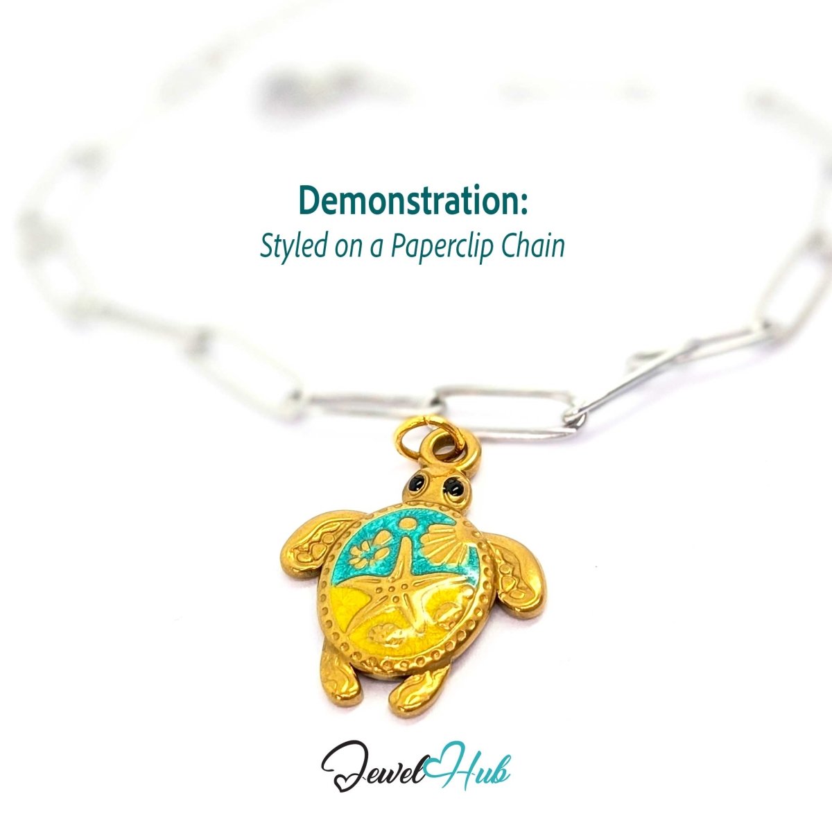 Gold sea turtle charm styled on a silver paperclip chain bracelet for a two-tone look - JewelHub