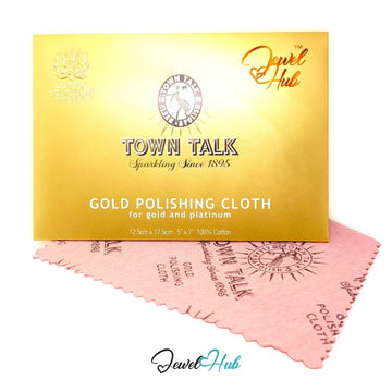 Town Talk Gold Polishing Cloth in its gold envelope, front view, with the pink cotton cloth fanned out beneath it — JewelHub.