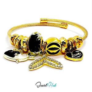 Gold Stainless Steel Black Fishtail & Whale Charm Bangle - JewelHub.co.uk