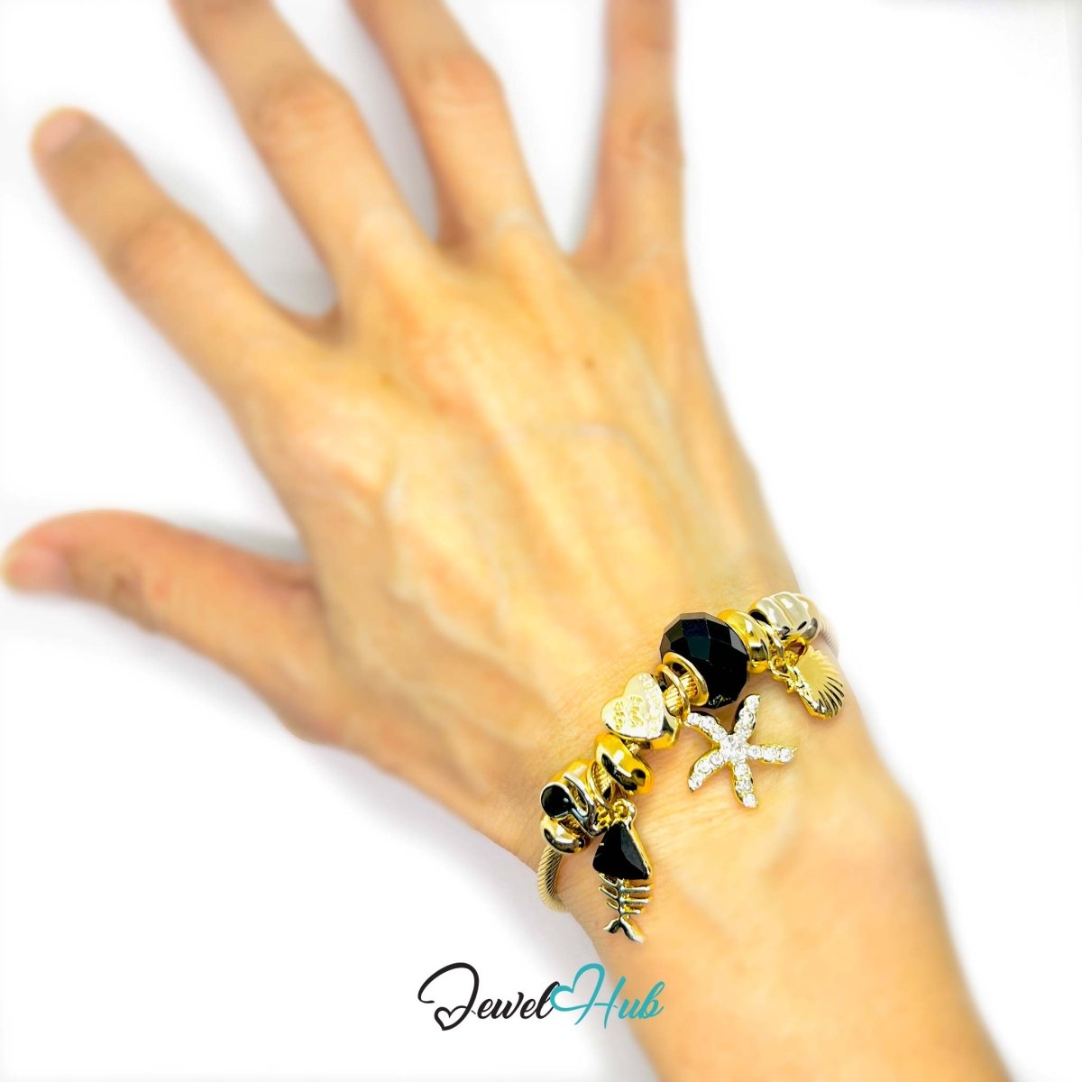 Gold Stainless Steel Black Gem Starfish Fishbone Charm Bangle - JewelHub.co.uk