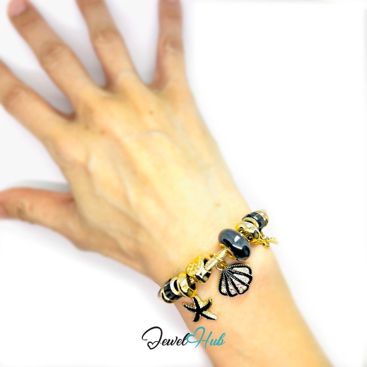 Gold Stainless Steel Black Shell & Starfish Beads Charm Bangle - JewelHub.co.uk